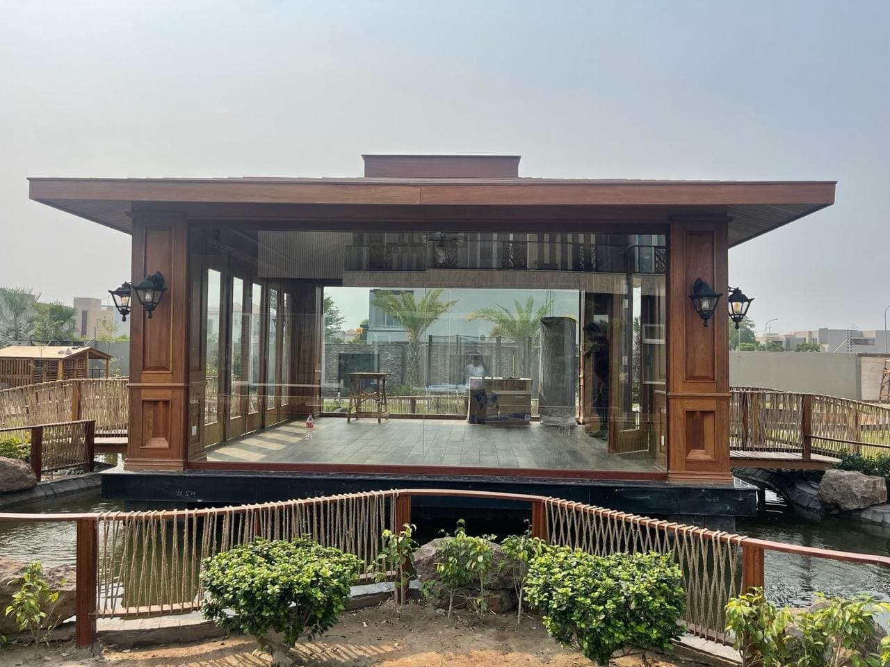 Garden pavilion surrounded by lawn and planting