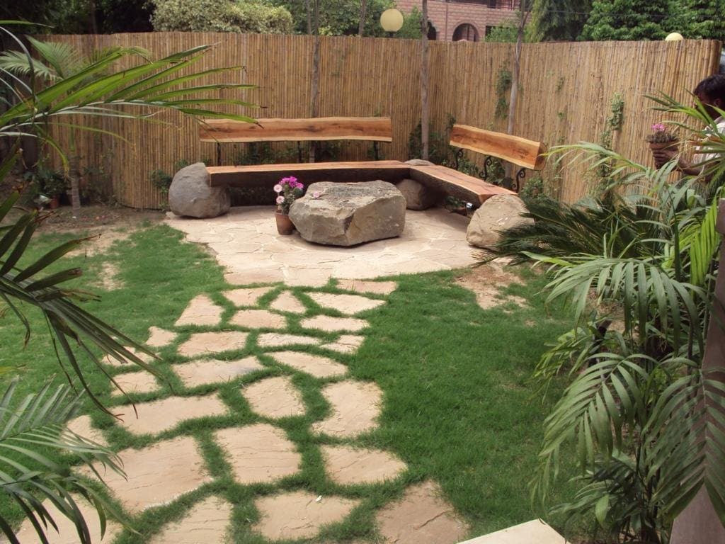 Irregular stepping-stone path installed through a planted garden